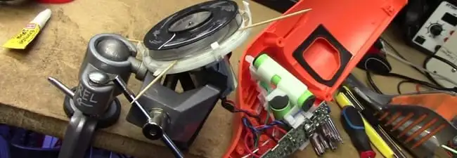 Vacuum cleaner repair parts and tools on a workbench in Norfolk, VA